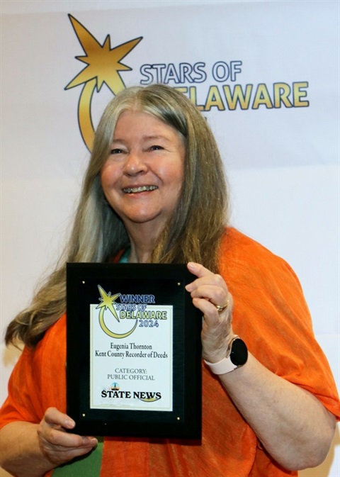 Photo of Eugenia Thornton and her Stars of Delaware Winner plaque at celebration event on Sept 5, 2024